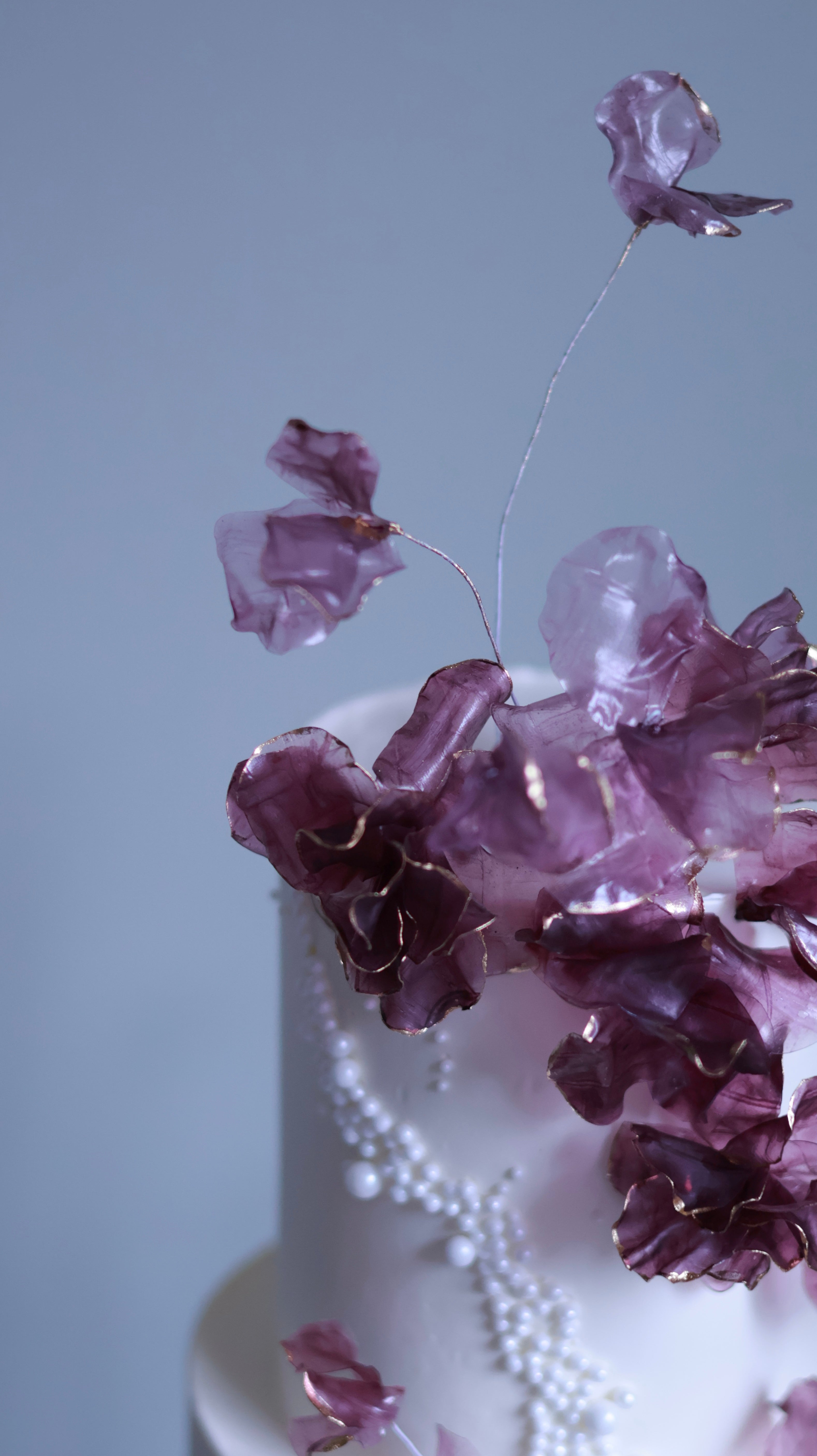 Purple sugar flower wedding cake