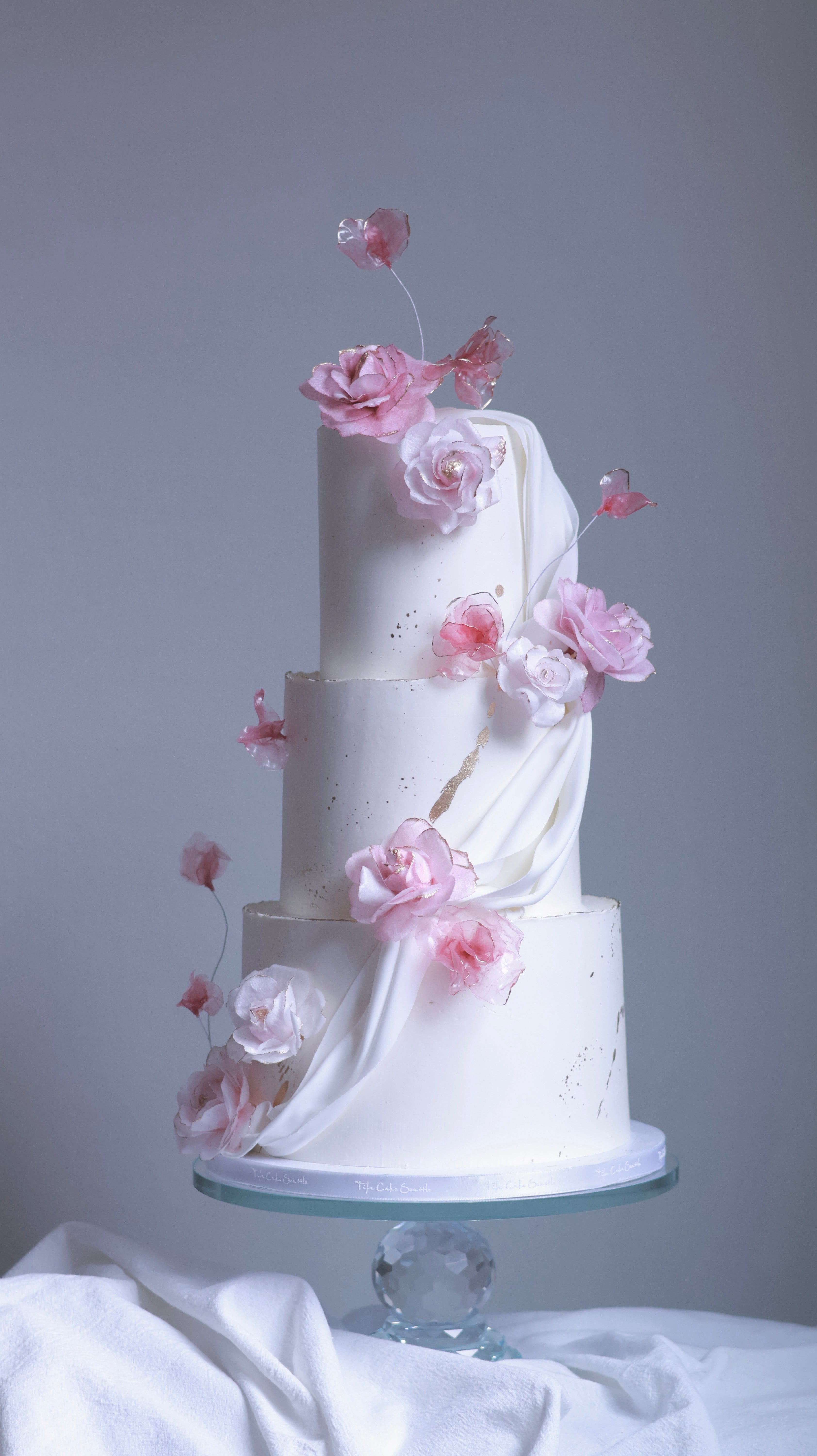 Pink sugar flower wedding cake