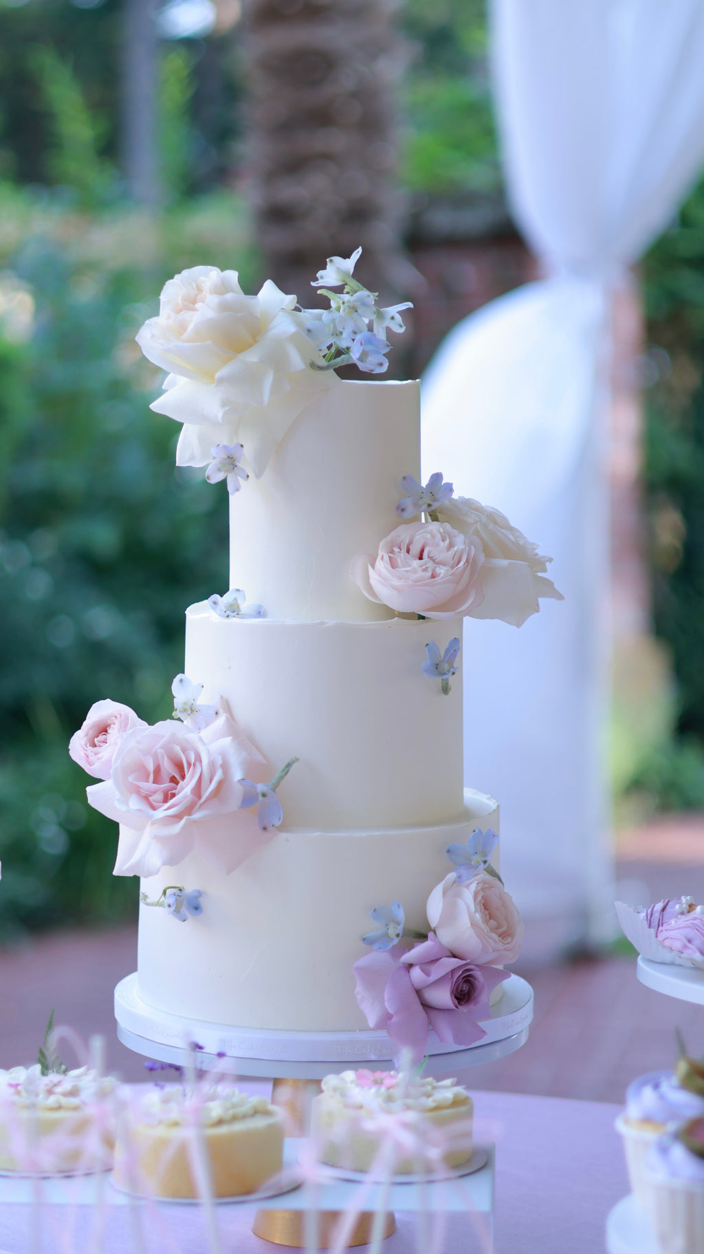 Purple/blue floral wedding cake
