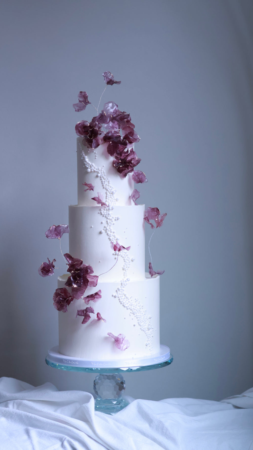 Purple sugar flower wedding cake